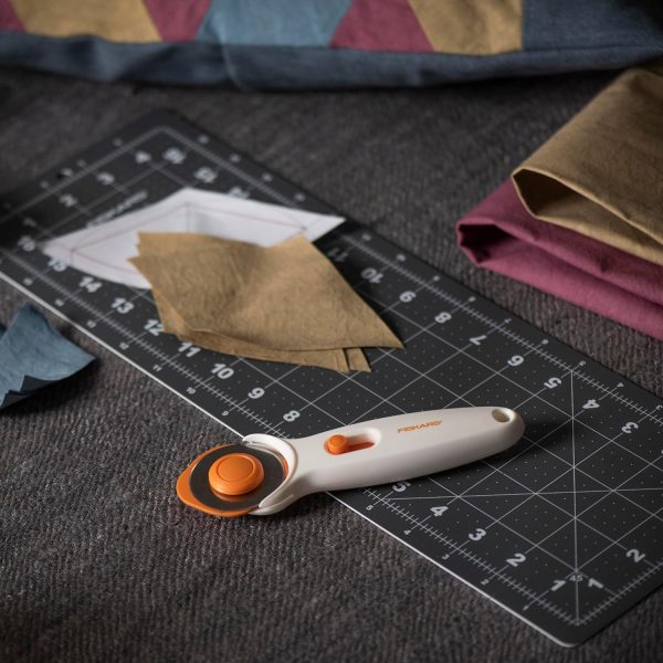 Fiskars 45mm Rotary Cutter for Fabric, Premium Steel Stick Fabric Cutter Cuts Through Multiple Layers, Right and Left Handed, Easy and Safe Blade Change, Arts and Crafts, Sewing and Quilting Tools - Image 2